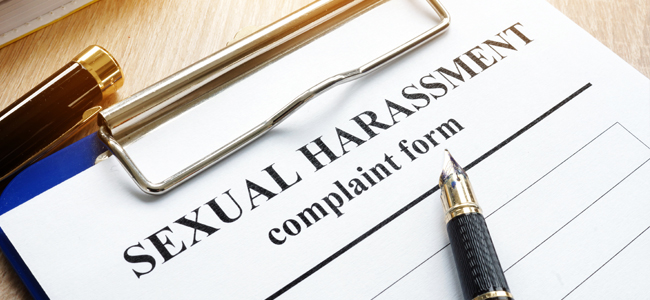 Sexual harassment complaint form on a desk.