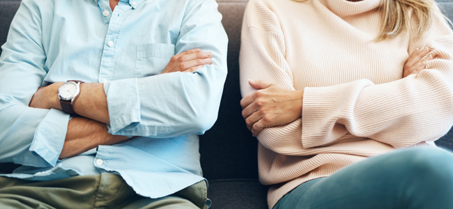 Divorce, fail and couple fight due to marriage problem, angry at home about family law and with conflict in a lounge. Anger, sad and people or partner frustrated due to infertility on a sofa