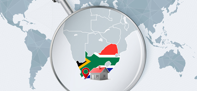 World map with a magnifying glass pointing at South Africa. Map