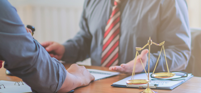 The lawyer is currently consulting on legal contract documents t